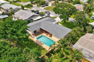 an aerial view of a house with a swimming pool at 3BR HEATED POOL CLOSE TO BEACH in Boynton Beach