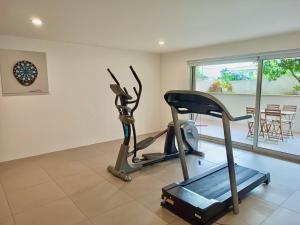 a room with a gym with a treadmill at Villa Branco - Private Pool & Garden in Barcelos