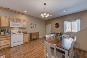 a kitchen and dining room with a table and chairs at Sunbeam Condo - Beautiful 2 Bedroom Stay by Beach in Pepin +14 photos
