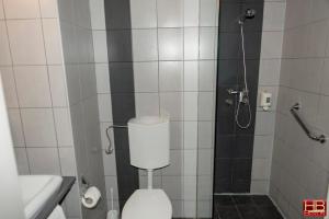 a bathroom with a shower with a toilet and a sink at FREE PARKING, FREE BREAKFAST, only 15 minutes to City Center in Budapest