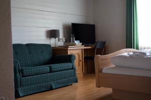 TV a/nebo společenská místnost v ubytování Vögeli Alpenhotel Malbun + 21 fotografií