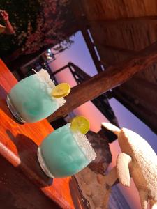 a group of three cocktails sitting on a table at Roma apartamento in Playa Blanca
