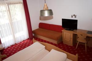 TV a/nebo společenská místnost v ubytování Vögeli Alpenhotel Malbun
