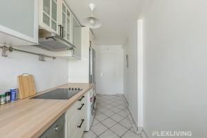 a kitchen with a sink and a counter top at Flexliving - room - Losserand in Paris