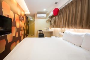 Katil atau katil-katil dalam bilik di Morwing Hotel - Culture Vogue