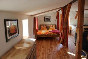 a bedroom with a bed in the middle of it at Rustikale Ferienwohnung im Obergeschoss in Kröslin