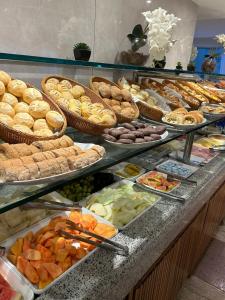 a buffet filled with lots of different types of food at Real Palace Hotel in Rio de Janeiro