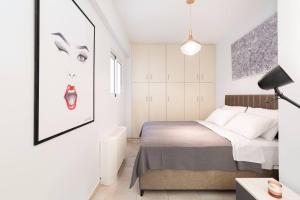 Katil atau katil-katil dalam bilik di Peaceful modern appartment near Lavrio port