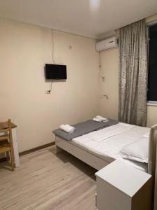 Voodi või voodid majutusasutuse Barakat Hotel toas