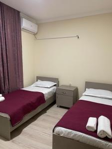 Voodi või voodid majutusasutuse Barakat Hotel toas
