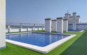 a swimming pool on the roof of a building at Amazing Apartment In Oropesa Del Mar in Oropesa del Mar