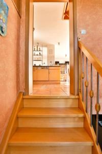 a staircase in a house with a kitchen at Ferienhaus Kottmann in Bremerhaven