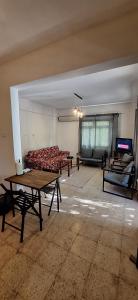a living room with a couch and a table at Summer house in Urla "Apartment 1" in Urla +23 photos