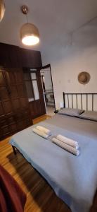 a bedroom with a large bed with towels on it at Summer house in Urla "Apartment 1" in Urla