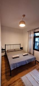 a bedroom with a bed with two pillows on it at Summer house in Urla "Apartment 1" in Urla