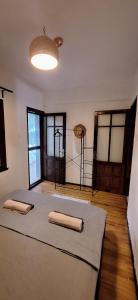 a room with a bed with two towels on it at Summer house in Urla "Apartment 1" in Urla