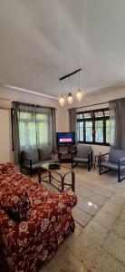 a living room with a bed and a piano at Summer house in Urla "Apartment 1" in Urla +23 photos