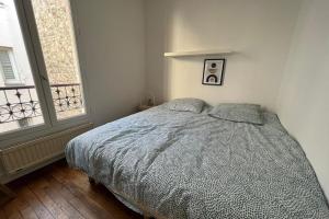 Ένα ή περισσότερα κρεβάτια σε δωμάτιο στο Flexliving - room - Jonquoy