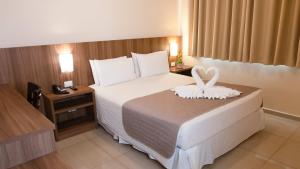 Postel nebo postele na pokoji v ubytování Pietro Angelo Hotel