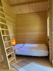 Postel nebo postele na pokoji v ubytování Tiny House am See + 5 fotografií