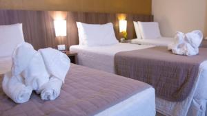 Postel nebo postele na pokoji v ubytování Pietro Angelo Hotel