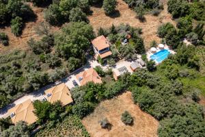 an overhead view of a house with a swimming pool at Apanema Mindfulness Resort Lefkada - ultra fast Starlink WiFi in 2025 in Asprogerakata