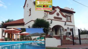 a house with a swimming pool in front of it at Posada del Infinito in Capilla del Monte +25 photos