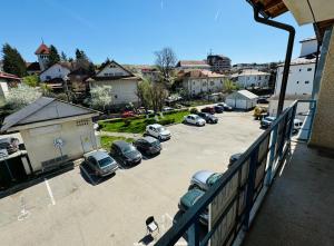 an aerial view of a parking lot with cars parked at Sara room in Curtea de Argeş
