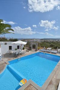 a pool at a villa with a view at Manos Apartments in Agios Nikolaos