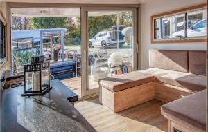 a living room with a couch and a table at 1 Bedroom Stunning Ship In Hennigsdorf in Hennigsdorf