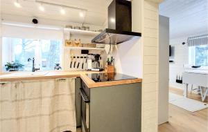 a kitchen with a counter top and a sink at Lovely Home In Ludvigsborg With Kitchen in Hörby