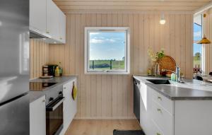a kitchen with a sink and a window at Lovely Home In Kalundborg With Wifi in Kalundborg