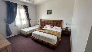 Postel nebo postele na pokoji v ubytování Isly Golf Hotel