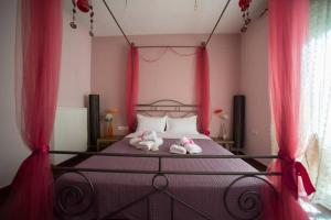 Postel nebo postele na pokoji v ubytování Volos Lux Apartment