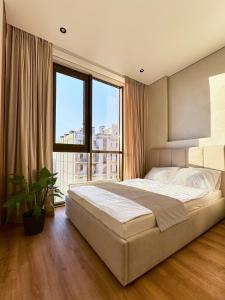 Postel nebo postele na pokoji v ubytování Apart Hotel Acropolis
