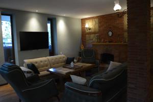 TV a/nebo společenská místnost v ubytování Velio Guest House