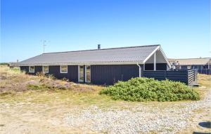 a house on the side of a hill at Holiday Home Arvidvej Iv in Bjerregård