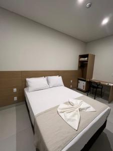 Giường trong phòng chung tại Hotel Premier Janauba +3 ảnh