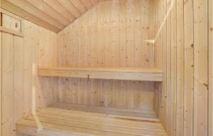 a wooden sauna with wooden shelves at Holiday Home Skovløkken Hejls Vi in Hejls