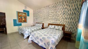 Gulta vai gultas numurā naktsmītnē Hotel Viña del Mar Omoa