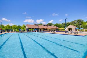 a large swimming pool at a resort at Hot Tub & Barrel Sauna: Lakefront Innsbrook Chalet in Wright City