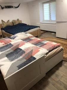 A bed or beds in a room at Útulný pokoj v soukromí