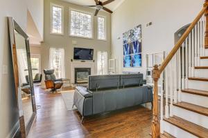 a living room with a couch and a fireplace at Spacious High Point Family Home with Yard and Grill in High Point