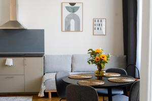 a living room with a table and a couch at Apartment Dusni Superior in Prague