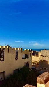 a view of a building with a blue sky at Résidence Palmeraie Aglou in Tiznit