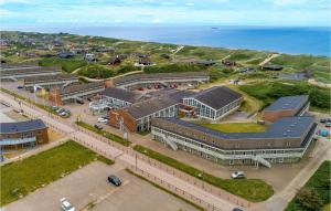 an aerial view of a building with the ocean in the background at Cozy Apartment In Ringkøbing in Ringkøbing