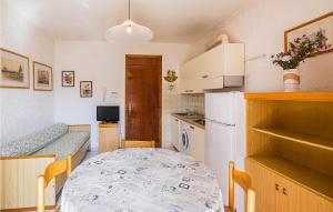 Kuchyň nebo kuchyňský kout v ubytování Ginestra Int,11B