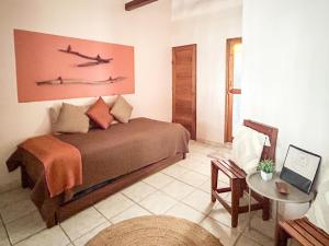 Кровать или кровати в номере Fenix Hotel - On the Beach