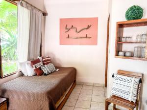 Кровать или кровати в номере Fenix Hotel - On the Beach