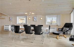 a dining room with a glass table and chairs at Nice Home In Hovborg With Kitchen in Hovborg